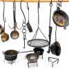 Medieval iron chains and hooks with medieval kitchen pots and medieval kitchen accessories for medieval kitchen or witchraft