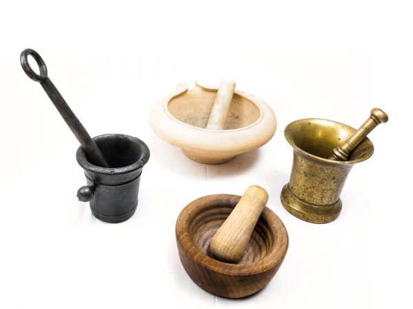 Historical medieval mortal and pestle sets made of wood, ceramic or brass.