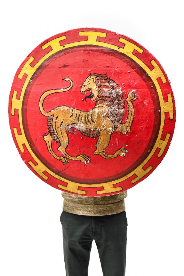 copy of antique greek shield gold and red with lion for rent or as a prop